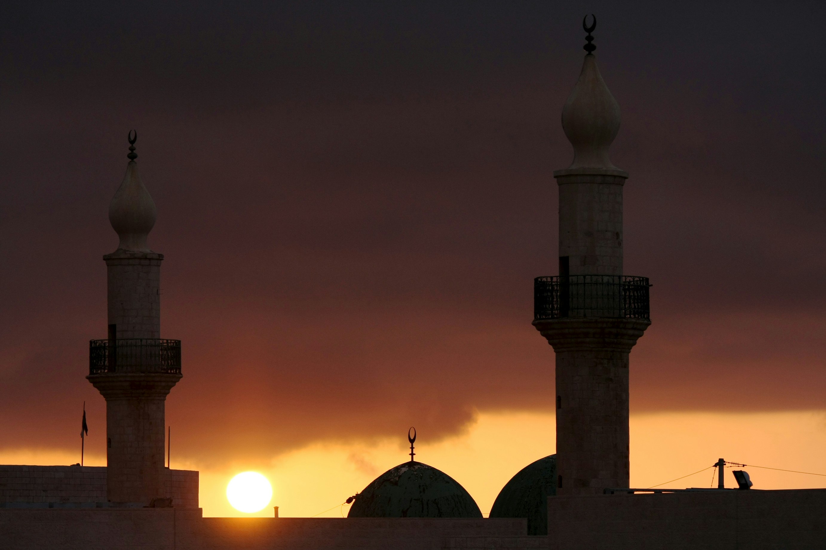 silhouette of mosque during sunset